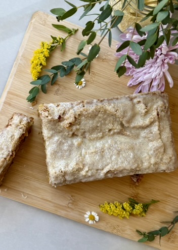 Finished Cornbread Donut Loaf sliced on a wooden serving board