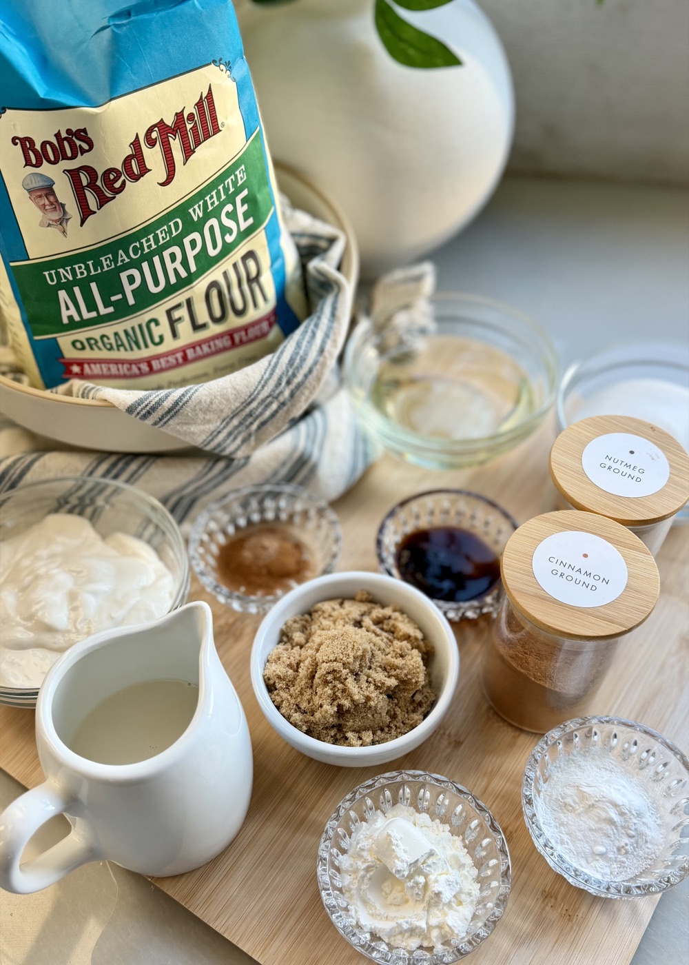 Ingredients for French toast donut loaf including cinnamon, nutmeg, brown sugar, yogurt, milk, and flour