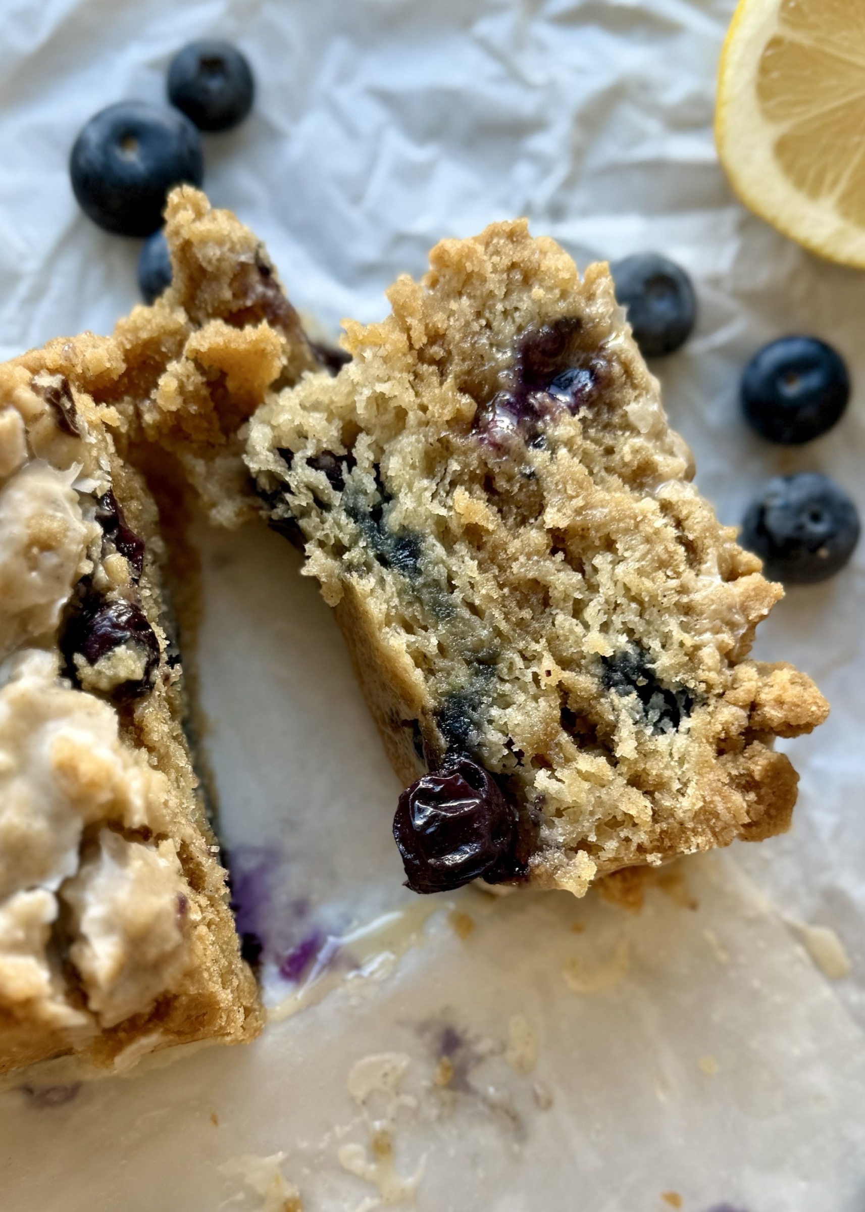 Close view of a blueberry-filled slice of Gluten-Free Blueberry Coffee Cake