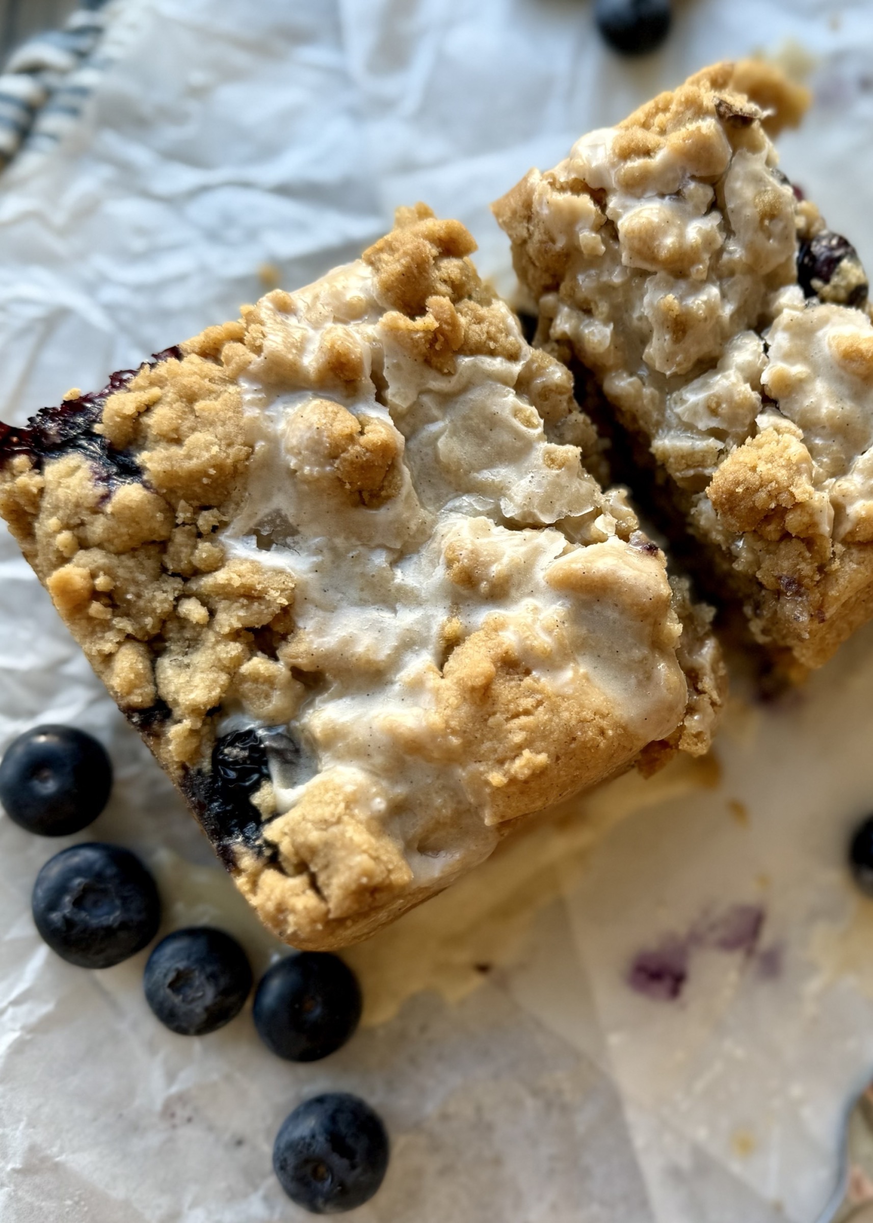 Close view of thick streusel and vanilla glaze on Gluten-Free Blueberry Coffee Cake