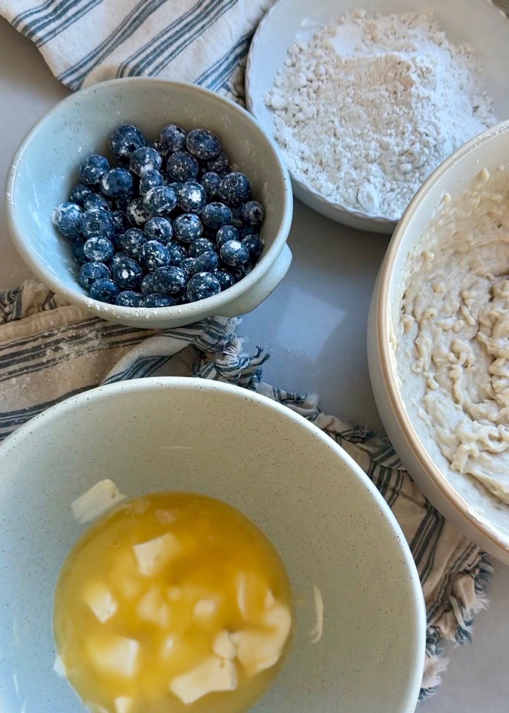 Blueberries, gluten-free flour, batter, and cold butter arranged for Gluten-Free Blueberry Coffee Cake