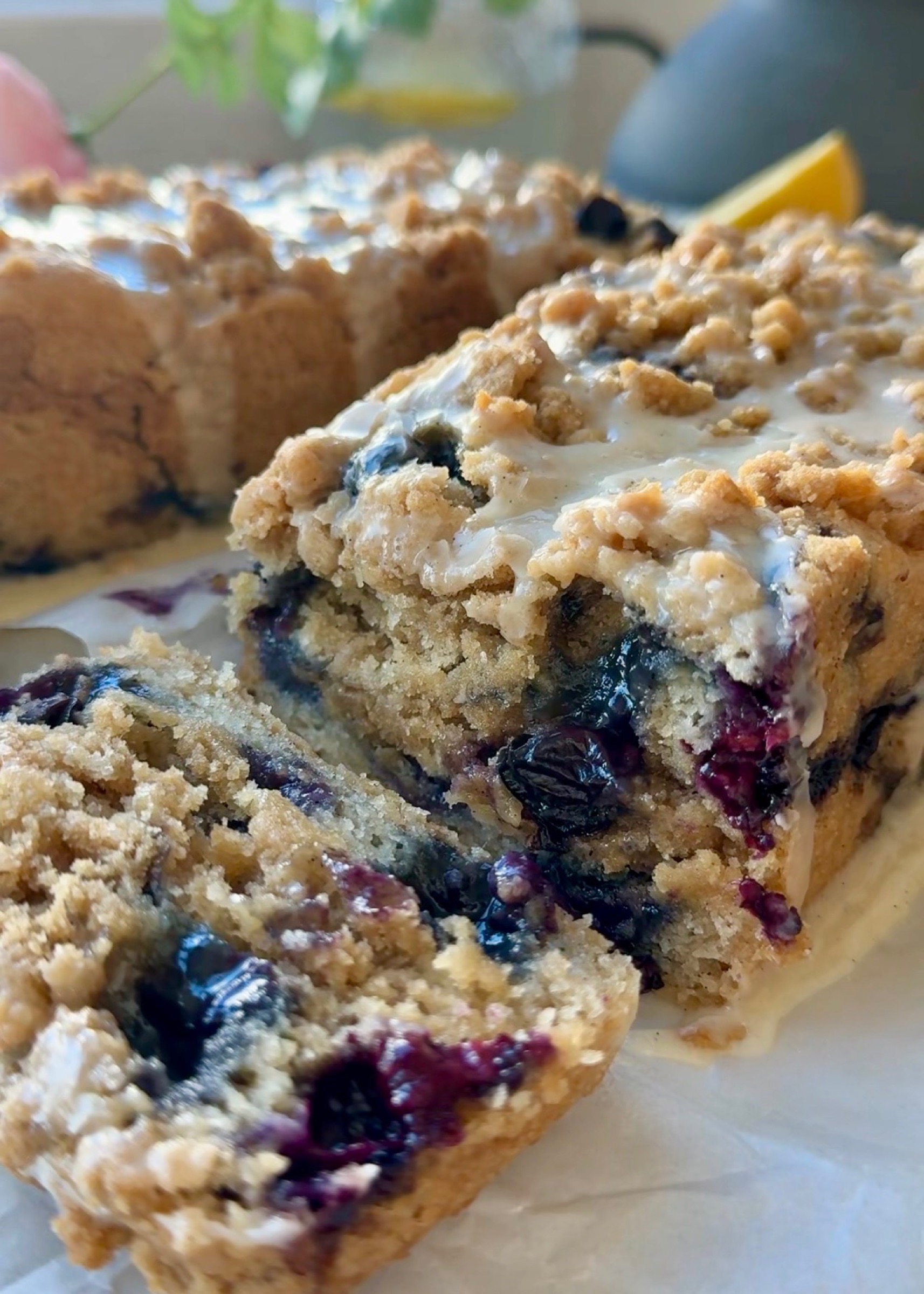 Sliced Gluten-Free Blueberry Coffee Cake showing fresh blueberries and a streusel seam