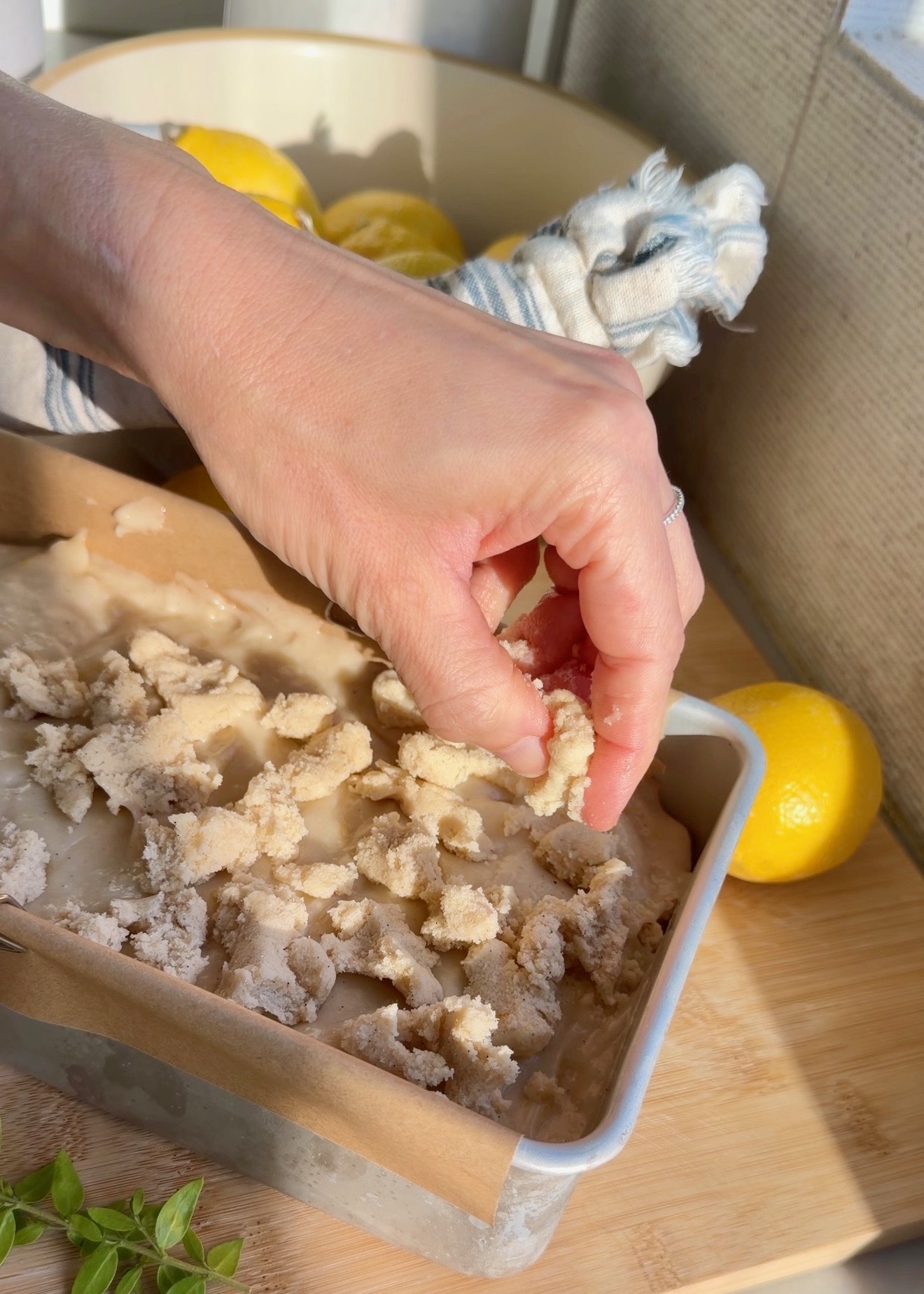 Large streusel clusters scattered over lemon loaf batter before baking