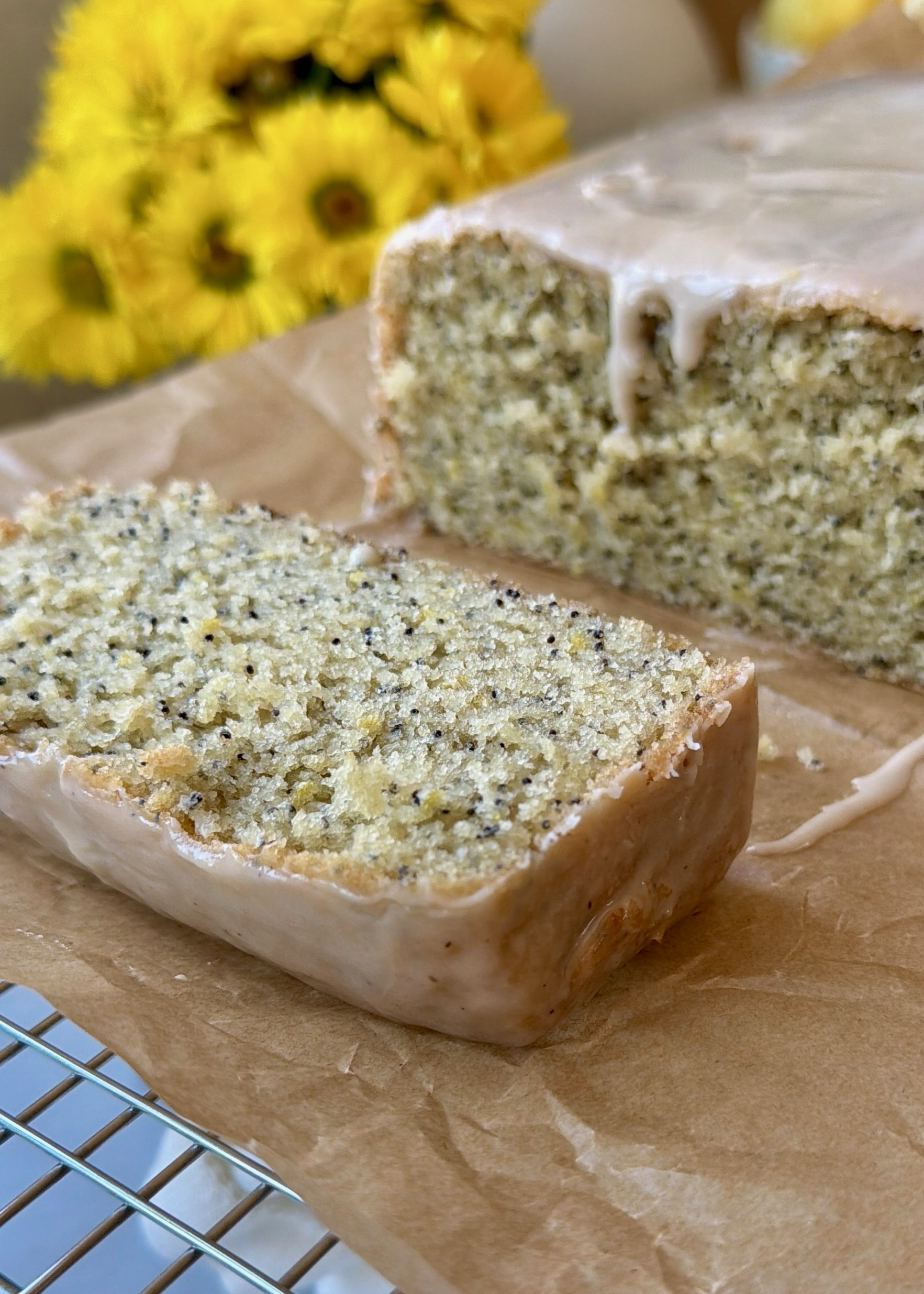 Sliced lemon poppy seed loaf showing its moist, fine crumb
