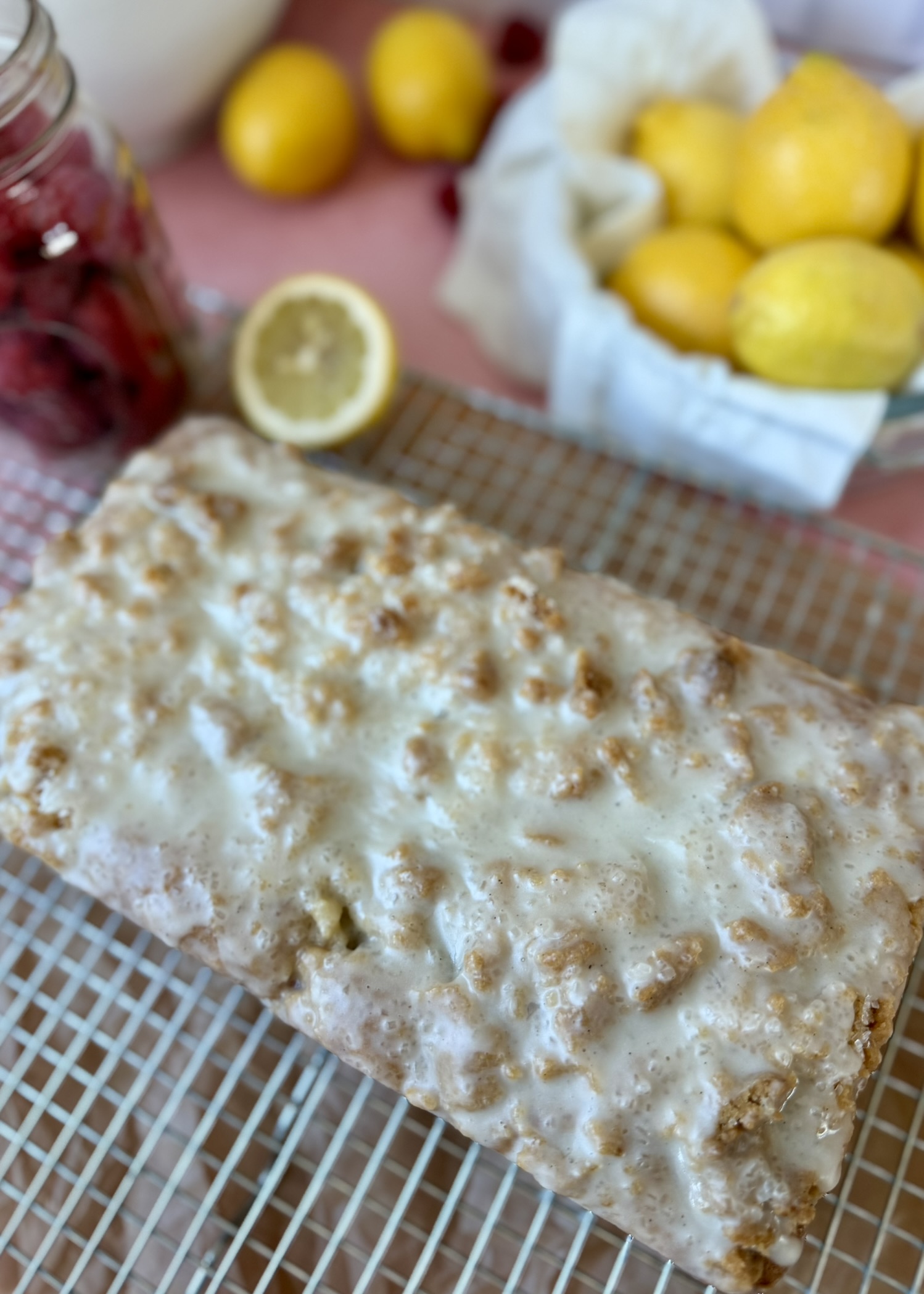 Close view of vanilla crackle glaze over lemon raspberry donut loaf streusel