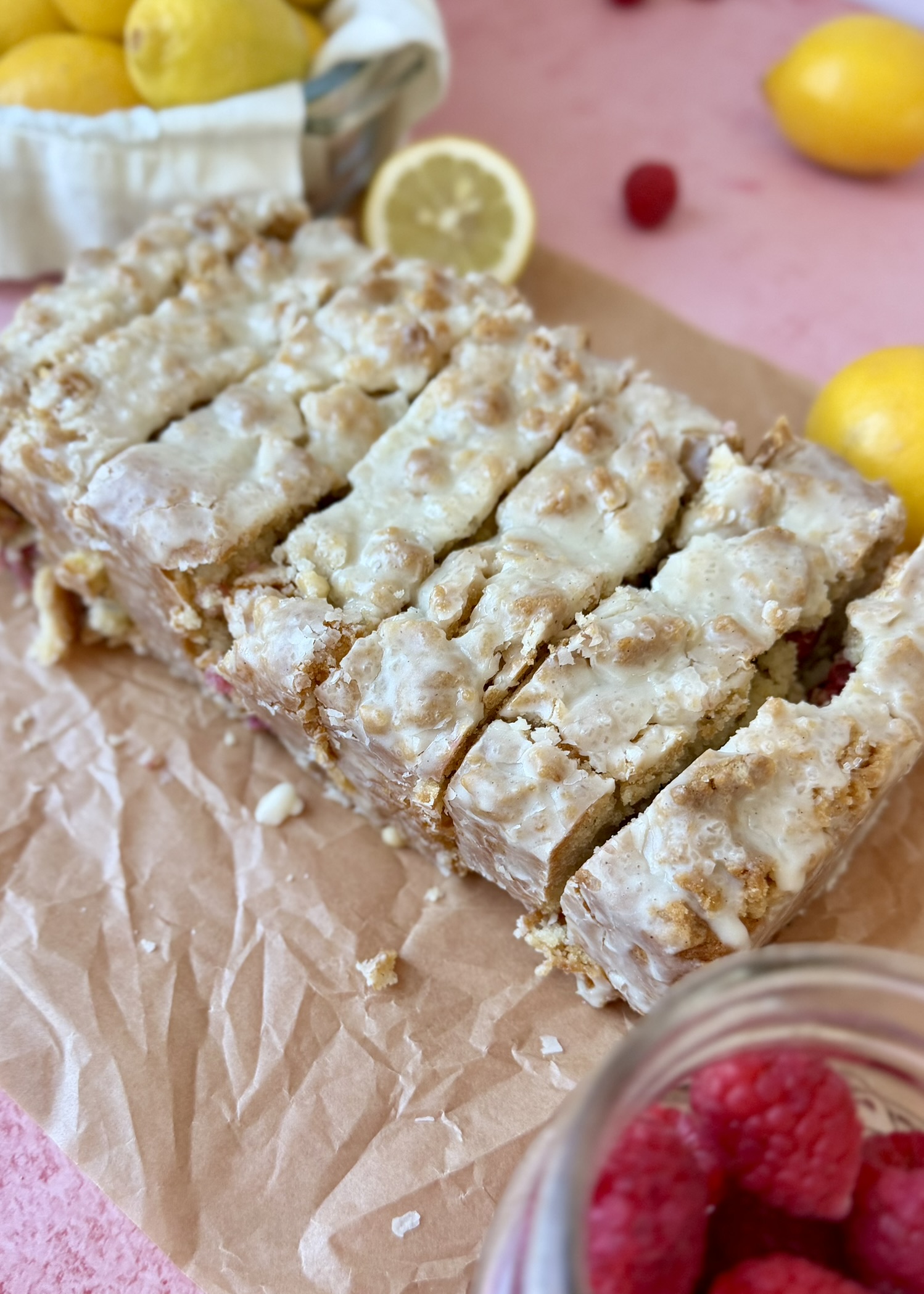 Overhead view of glazed Lemon Raspberry Old-Fashioned Donut Loaf slices