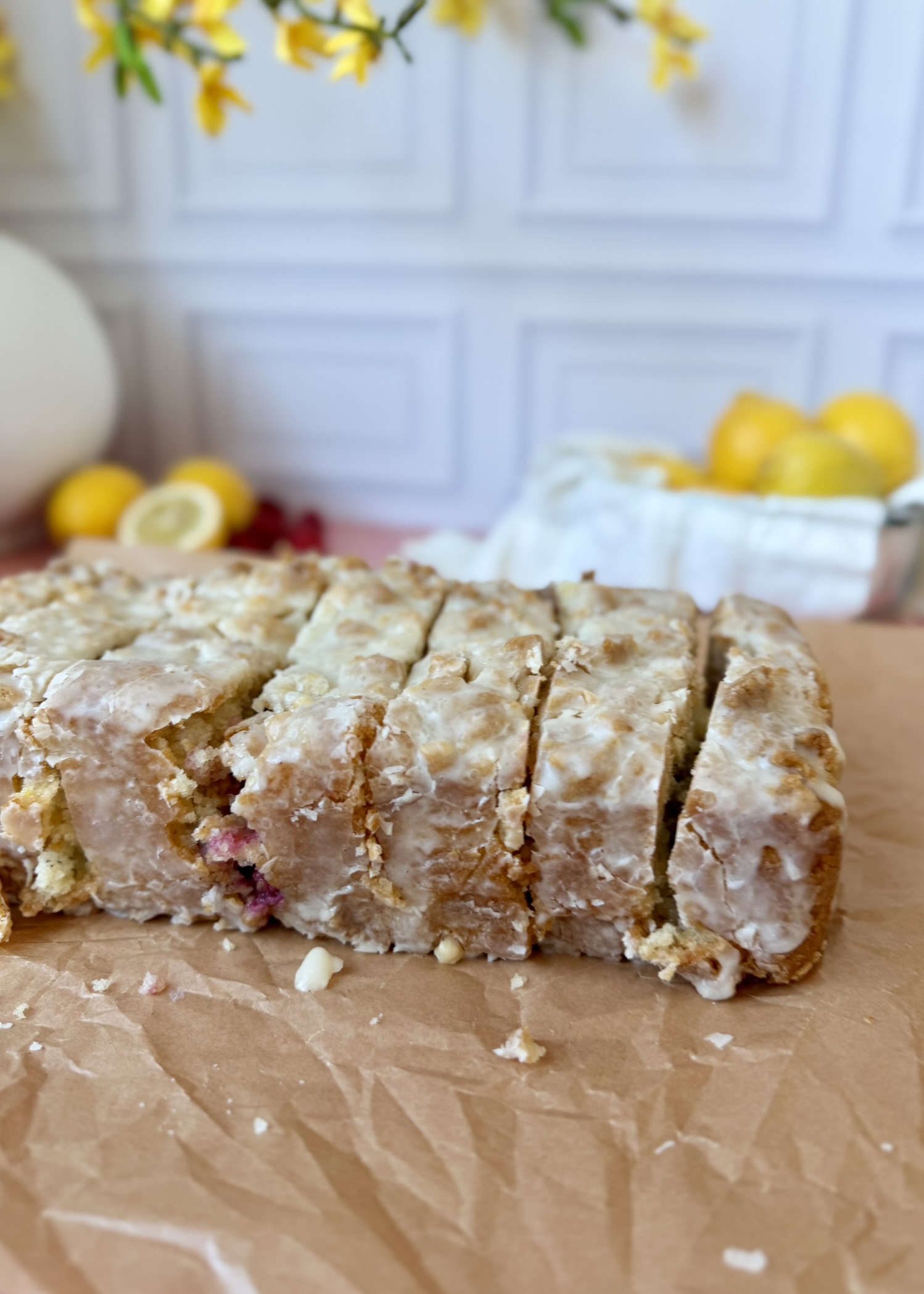 Sliced Lemon Raspberry Old-Fashioned Donut Loaf showing fresh raspberry pockets