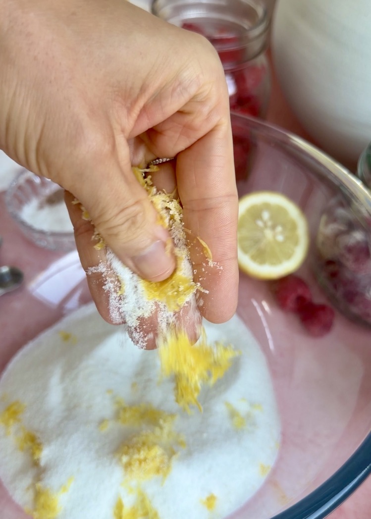 Lemon Raspberry Old-Fashioned Donut Loaf: rubbing lemon zest