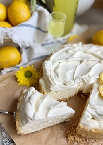 Limoncello Cheesecake Mousse with one slice lifted from the graham cracker crust