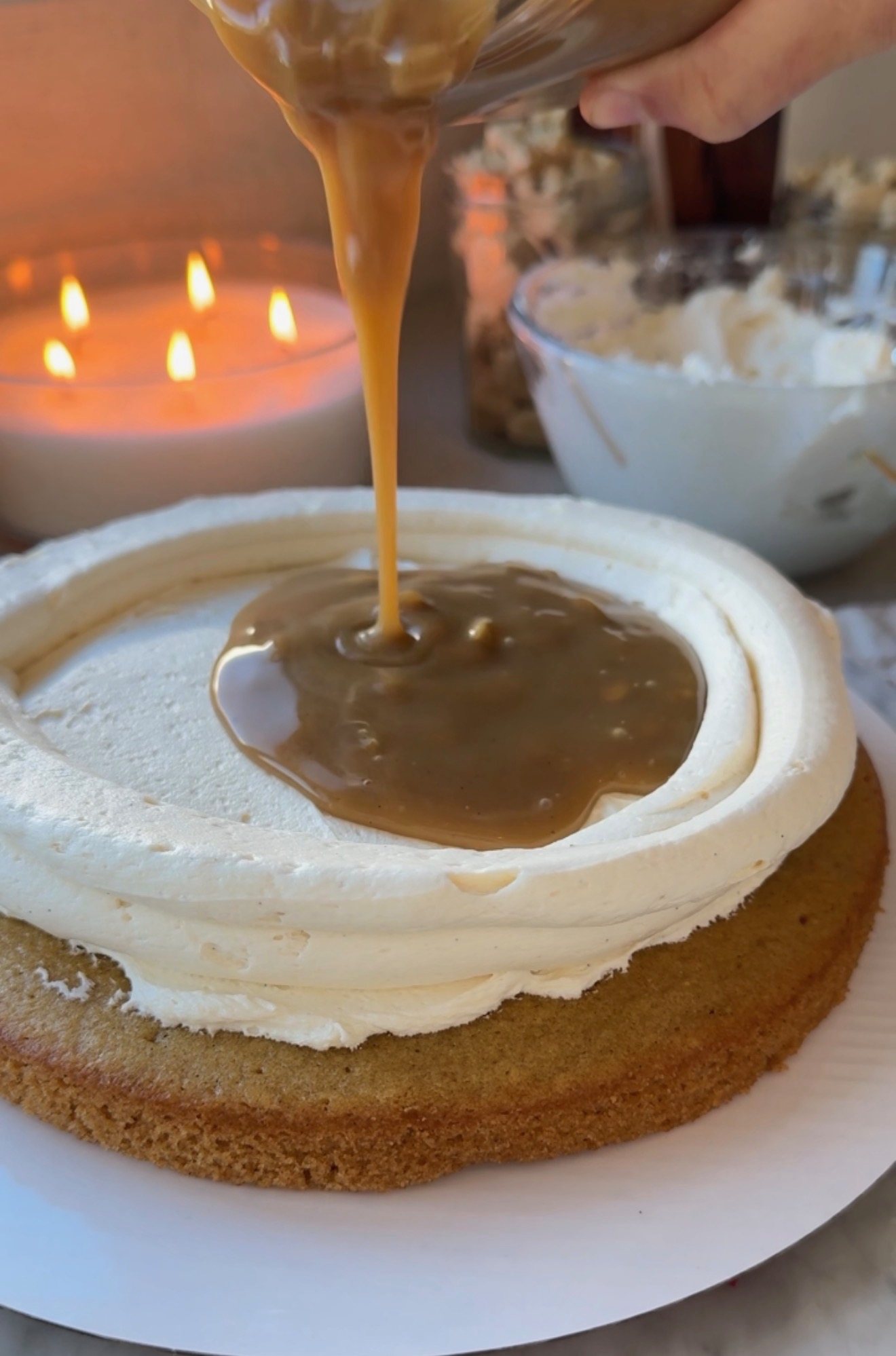 Brown sugar caramel lava pouring into a vanilla buttercream dam on oatmeal cake
