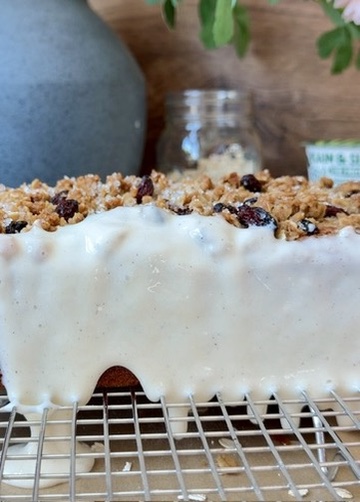 Vanilla donut glaze running down the side of Oatmeal Cookie Donut Loaf