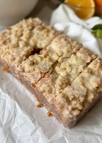 Close view of a glazed Orange Old-Fashioned Donut Loaf with streusel