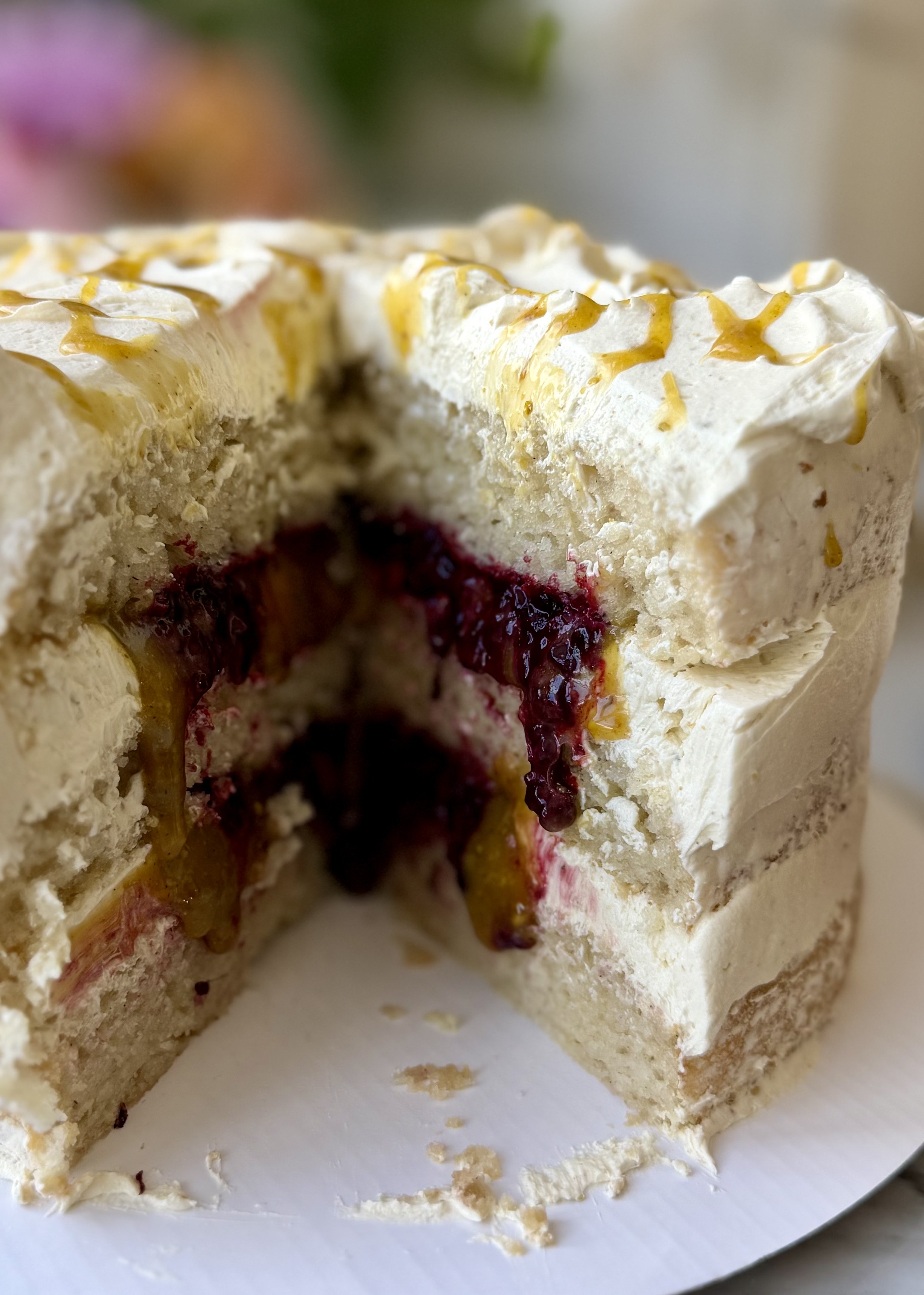 Cut Pistachio Blackberry Lava Cake showing pistachio filling and blackberry compote