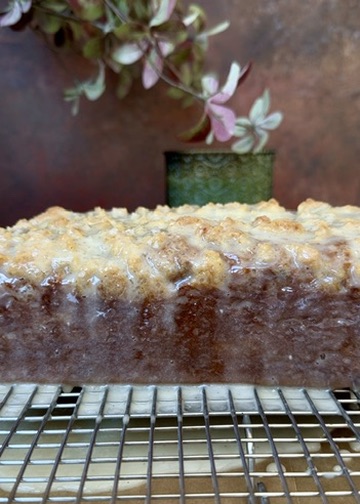 Finished glazed Pumpkin Spice Old-Fashioned Donut Loaf on a cooling rack