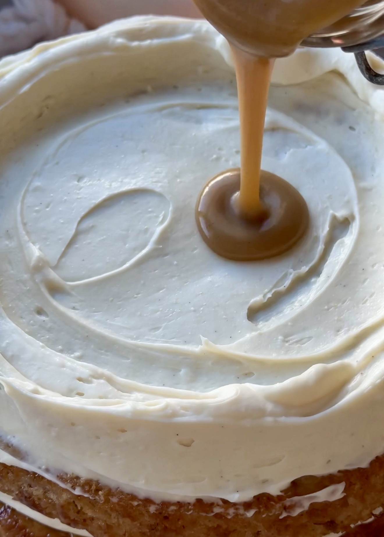 Salted brown sugar caramel lava poured inside a cheesecake frosting dam