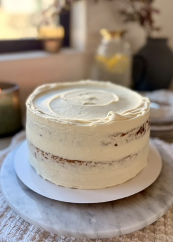 Whole Salted Banana Caramel Cheesecake Cake with softly swirled frosting