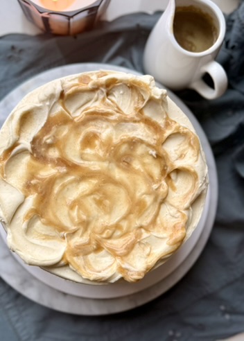 Overhead view of salted caramel swirled over the frosted blondie cake