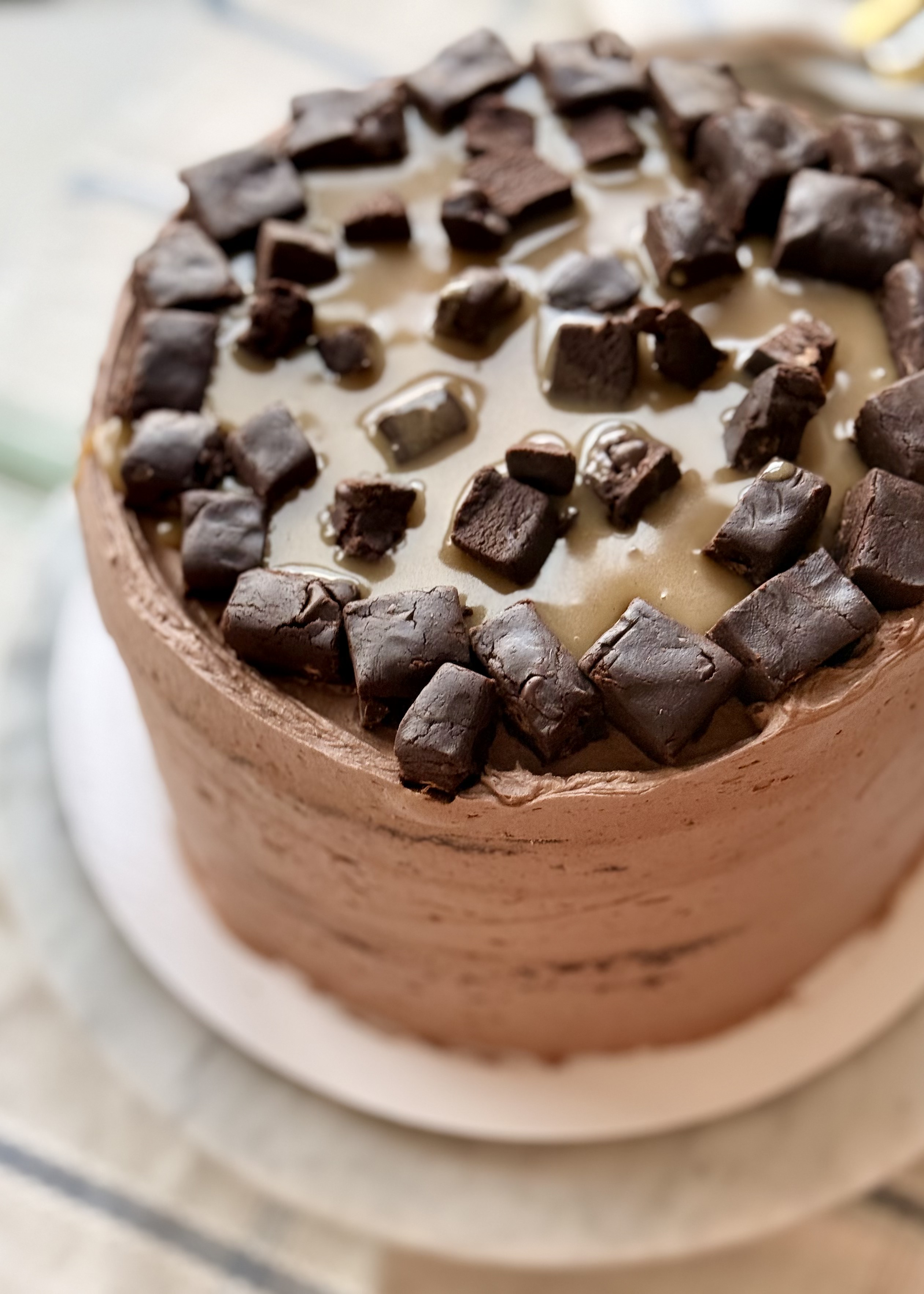 Finished Salted Caramel Brownie Lava Cake topped with caramel and brownie batter squares