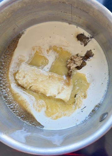 Brown sugar, butter, and cream melting together for salted caramel