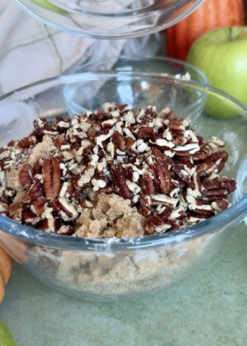 Pecans being folded into brown sugar streusel