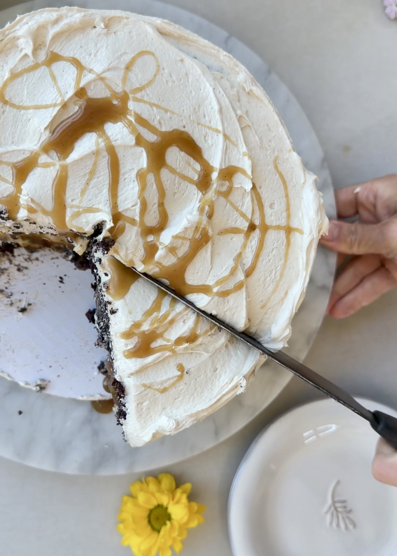 Knife cutting through a caramel-drizzled Salted Caramel Mocha Lava Cake