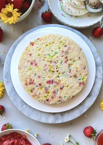 Baked vanilla cake batter layer filled with colorful sprinkles