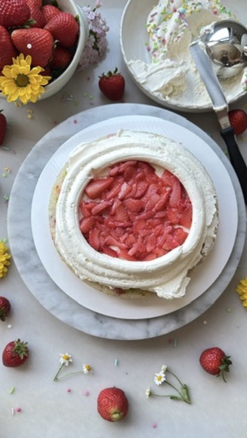 Fresh strawberry filling contained inside a ring of whipped buttercream
