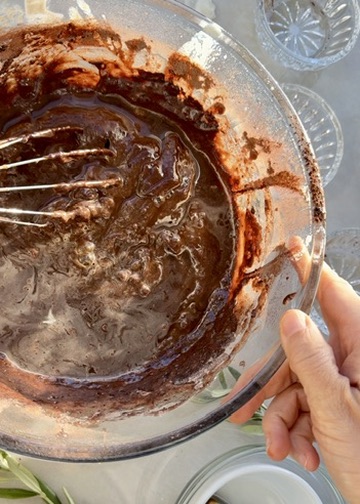 Warm Mocha Poke Cake: icing whisk