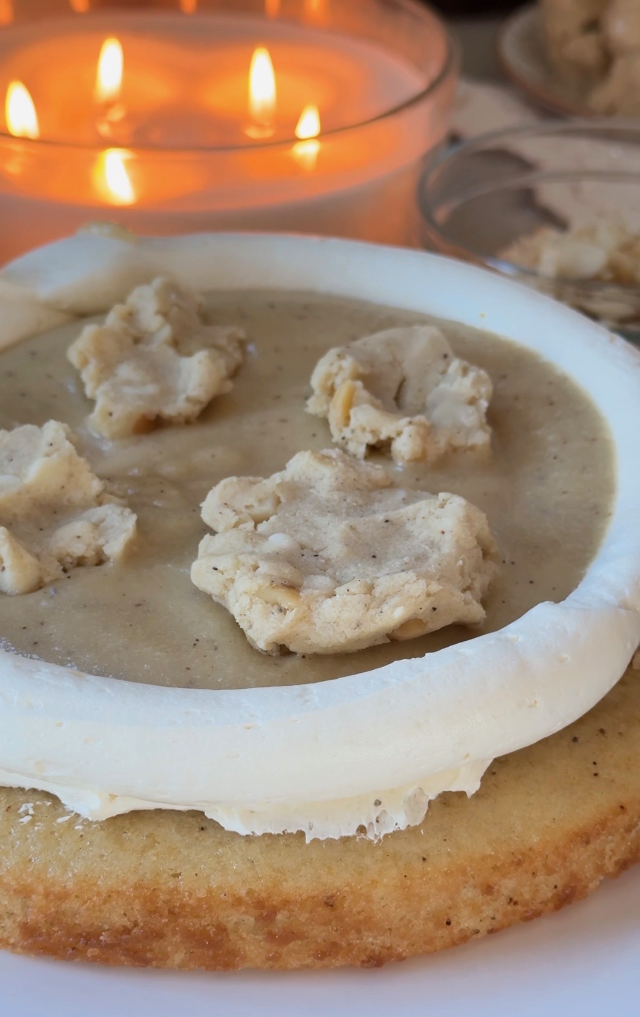 White chocolate macadamia cookie dough chunks arranged over vanilla lava