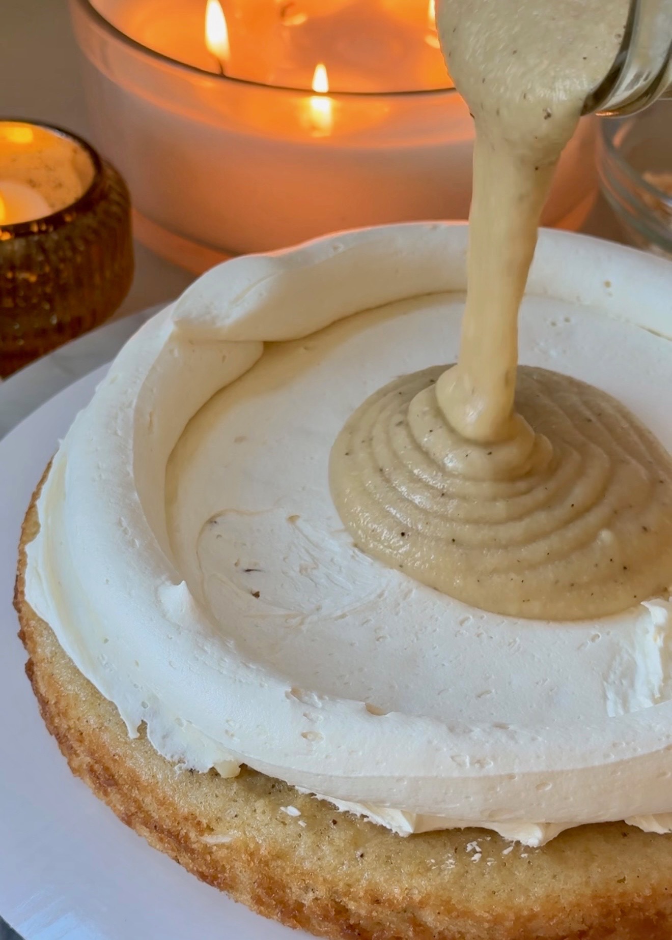 Vanilla-white chocolate lava pouring into a vanilla buttercream dam